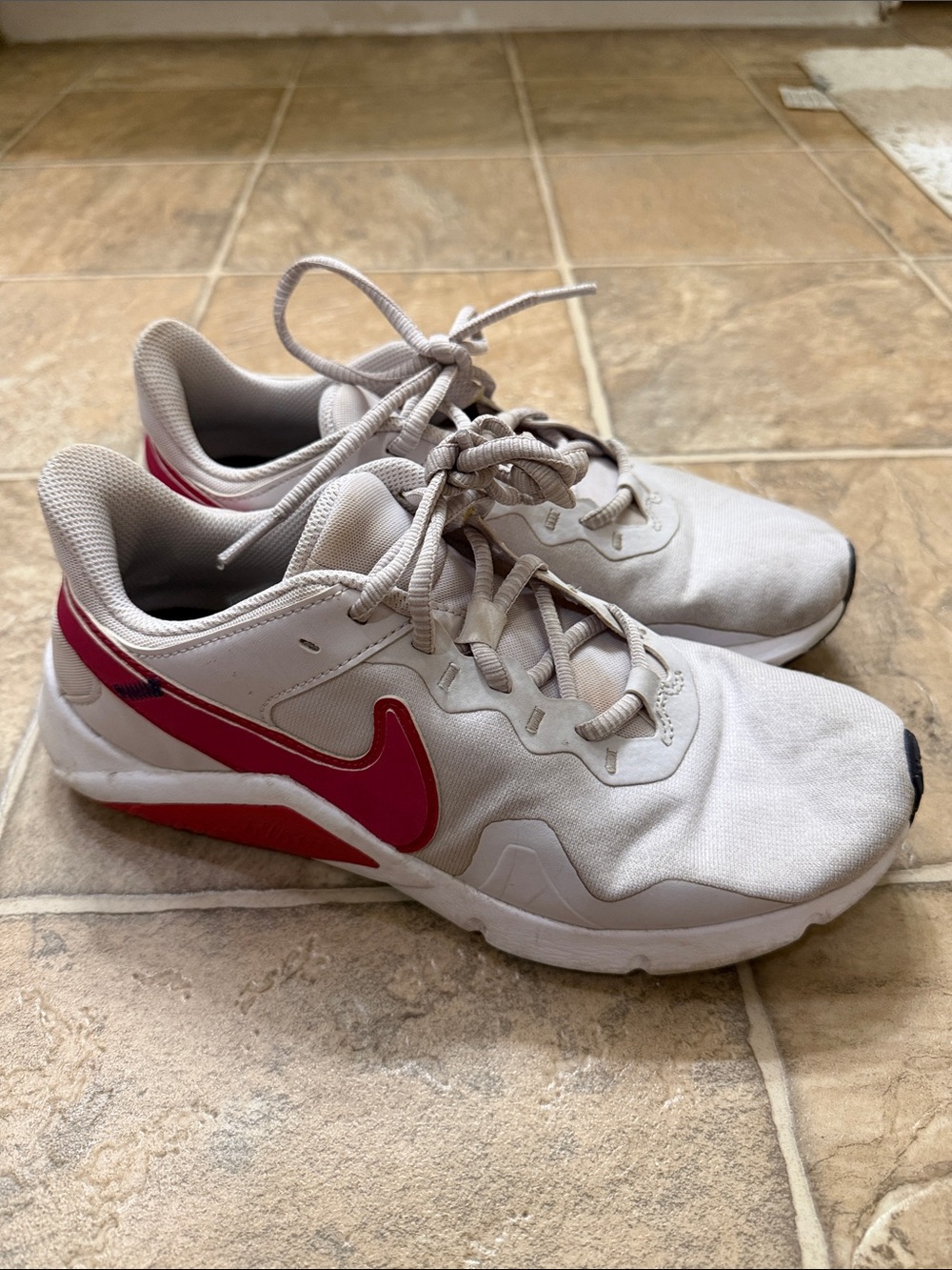 Nike White Sneakers with Pink Swoosh Accent